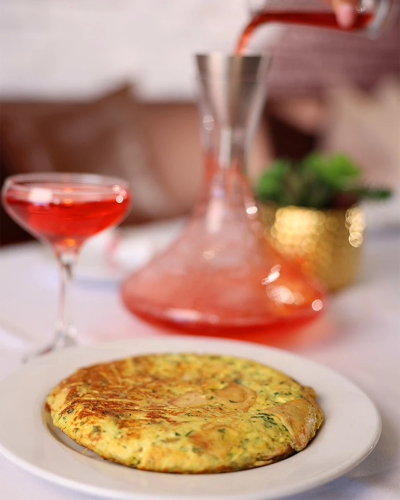 Spanish omelet cut thick and served warm at weekend brunch